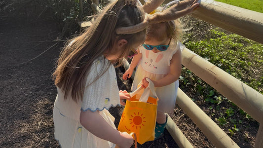 Children On A Trail With a Bright Orange Tote Bag