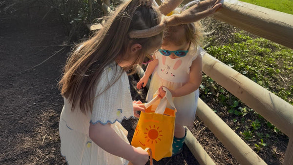 Children On A Trail With a Bright Orange Tote Bag