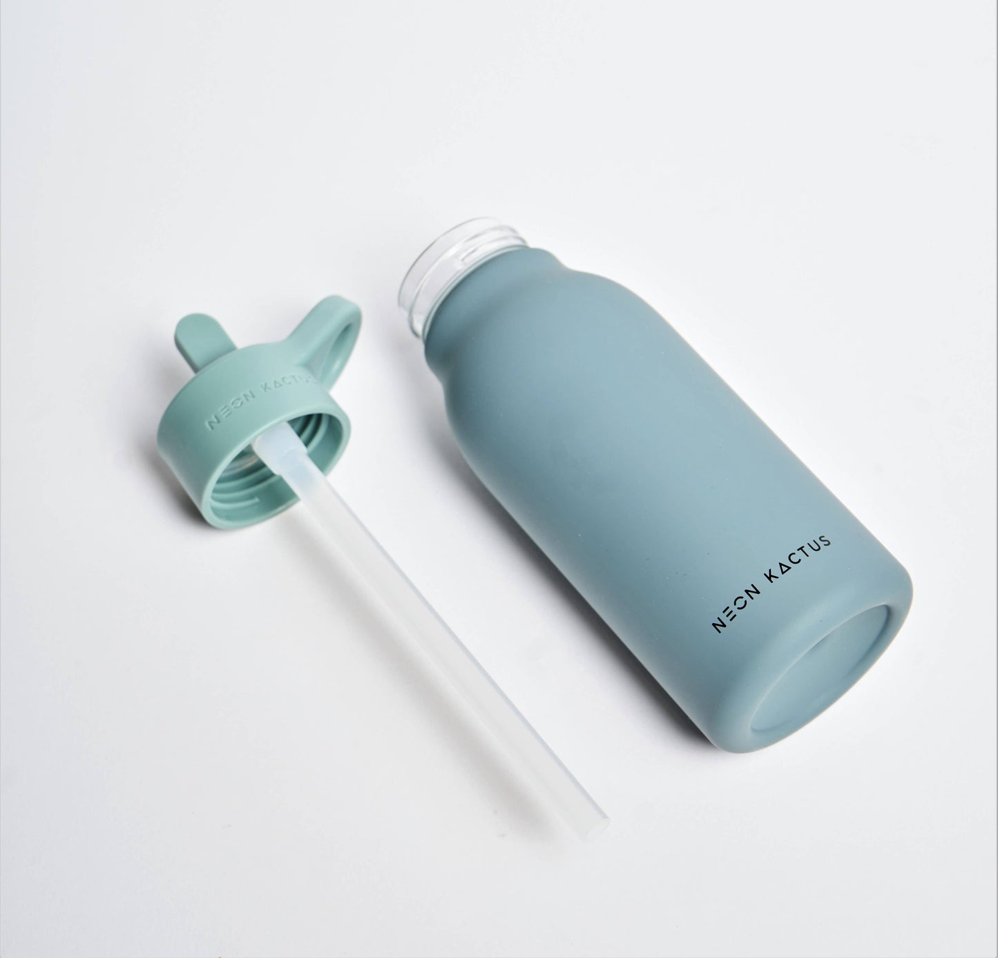 Blue water bottle with a straw lid on a white background