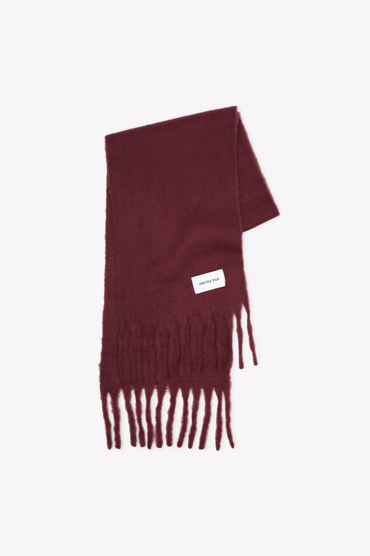 Burgundy scarf with fringes on a white background