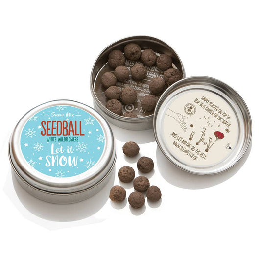 Seed balls in a tin with decorative labels on a white background