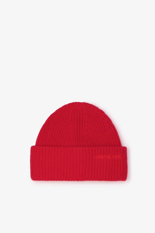Red knit beanie on a white background